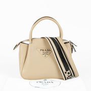 Shop this 100% authentic Prada Clay Grey Small Handbag at Labellov.com