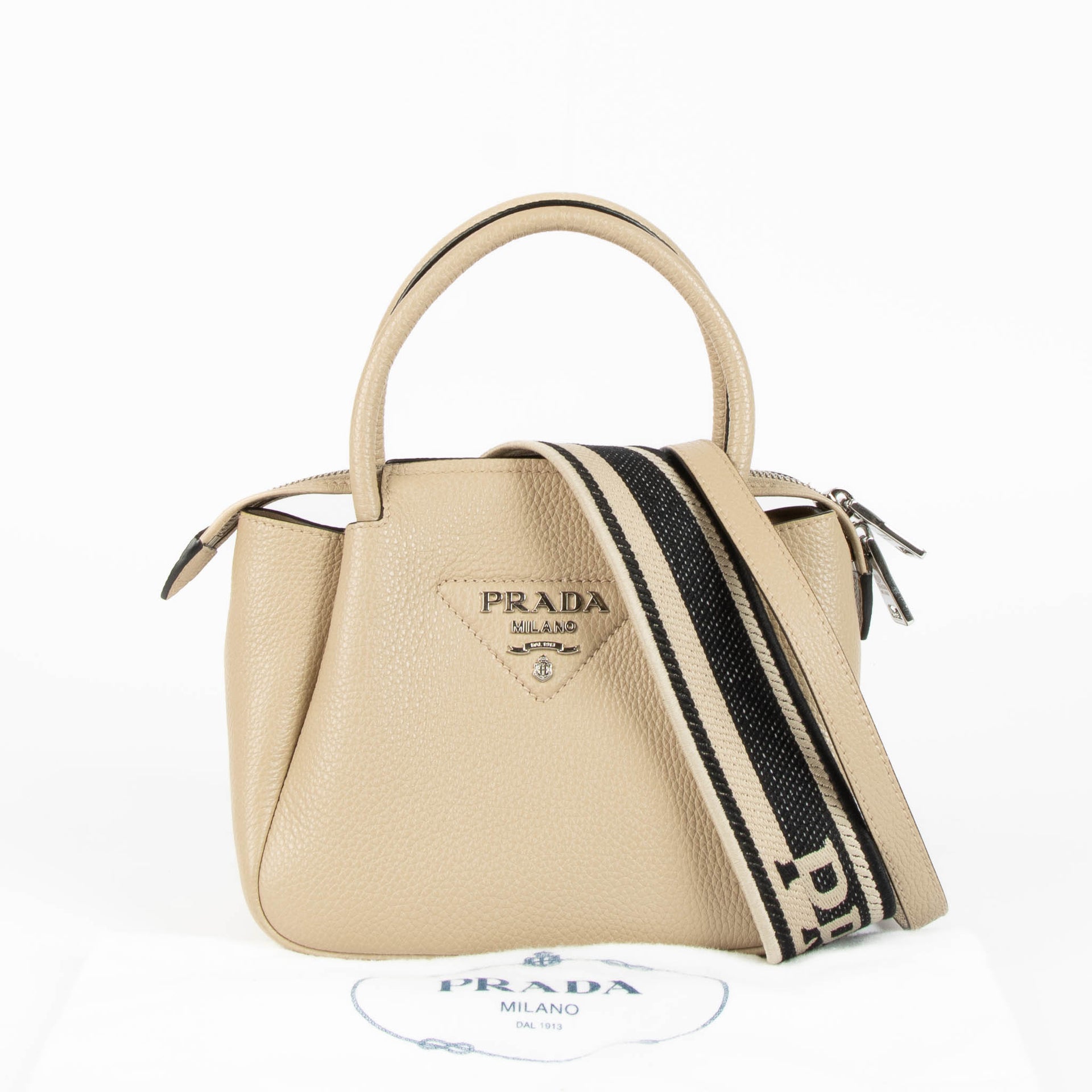 Shop this 100% authentic Prada Clay Grey Small Handbag at Labellov.com