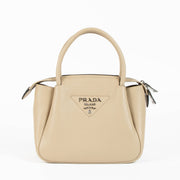 Shop this 100% authentic Prada Clay Grey Small Handbag at Labellov.com