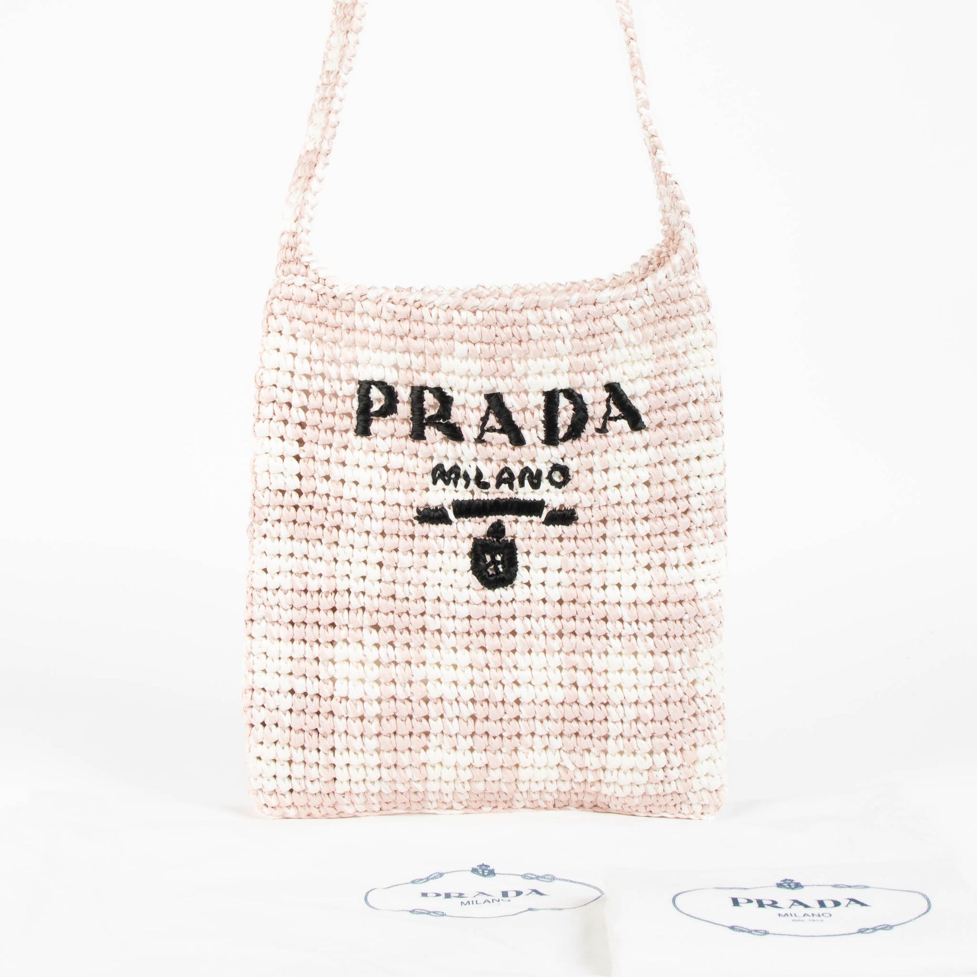 Shop this 100% authentic Prada Pink Raffia Bag at Labellov.com