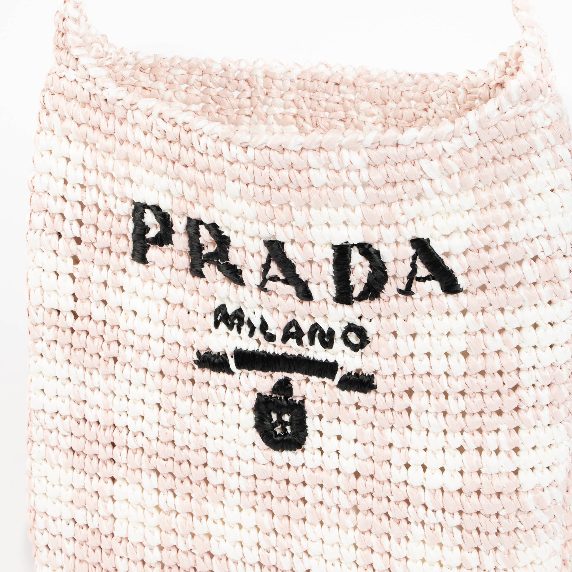 Shop this 100% authentic Prada Pink Raffia Bag at Labellov.com
