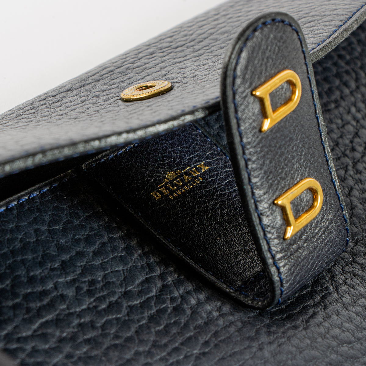 Shop this authentic Delvaux Blue Clutch pre-loved on Labellov.com