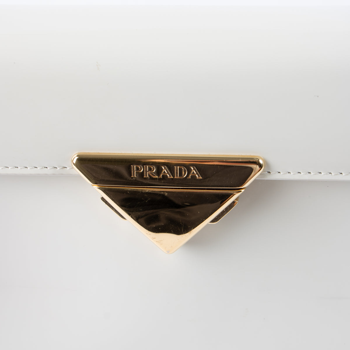 shop this authentic Prada White Brushed Leather Triangle Shoulder bag pre-loved on Labellov.com
