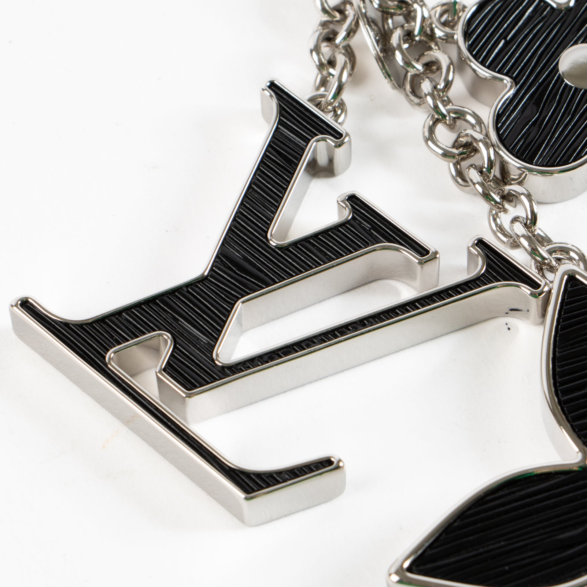 Shop the authentic Louis Vuitton Black Silver Charm on Labellov.com !
