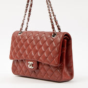 Shop this authentic Chanel Red Lambskin Medium Classic 11.12 Handbag pre-loved on Labellov.com
