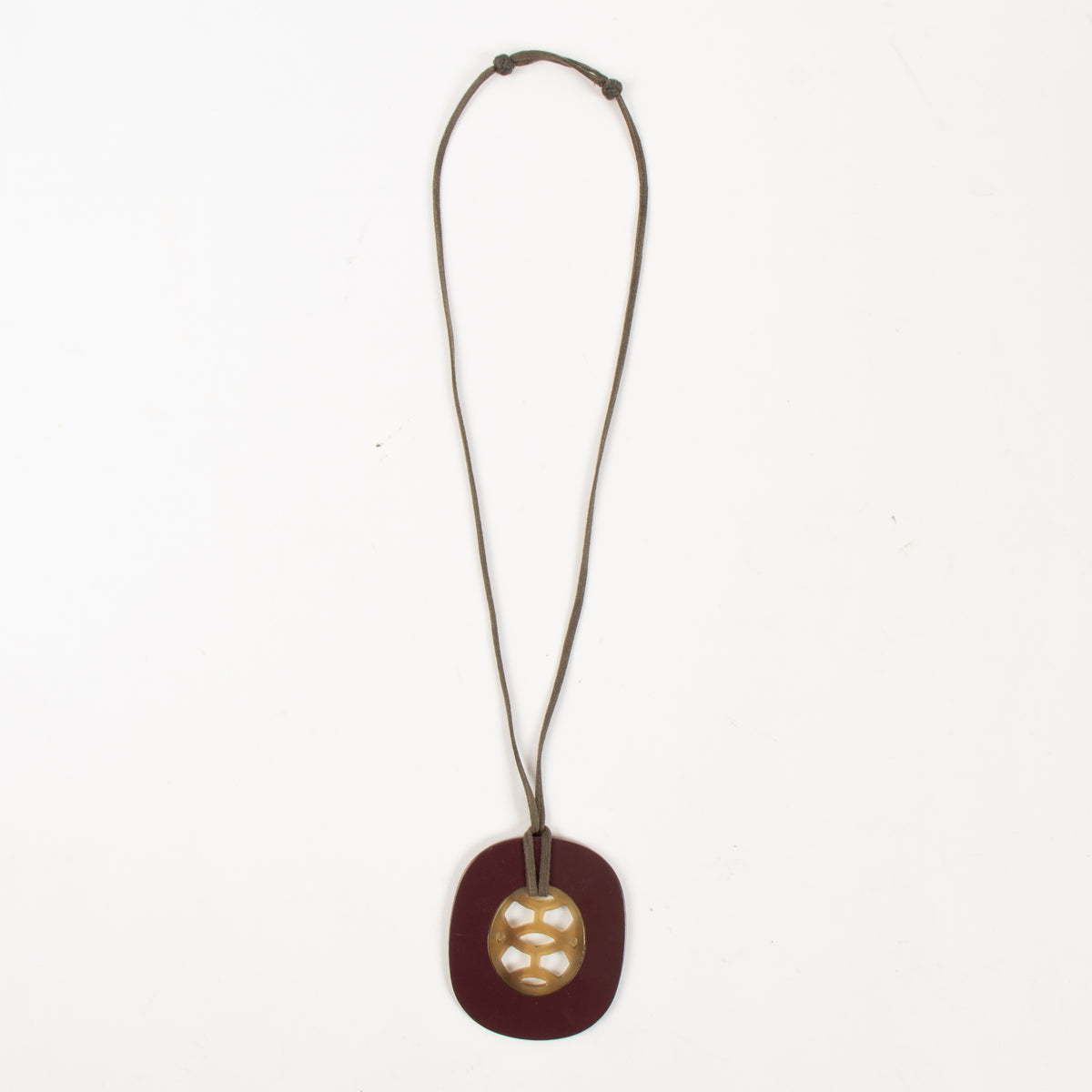 Shop this authentic  Hermes Burgundy Buffalo Horn Lift Necklace pre-loved on Labellov.com