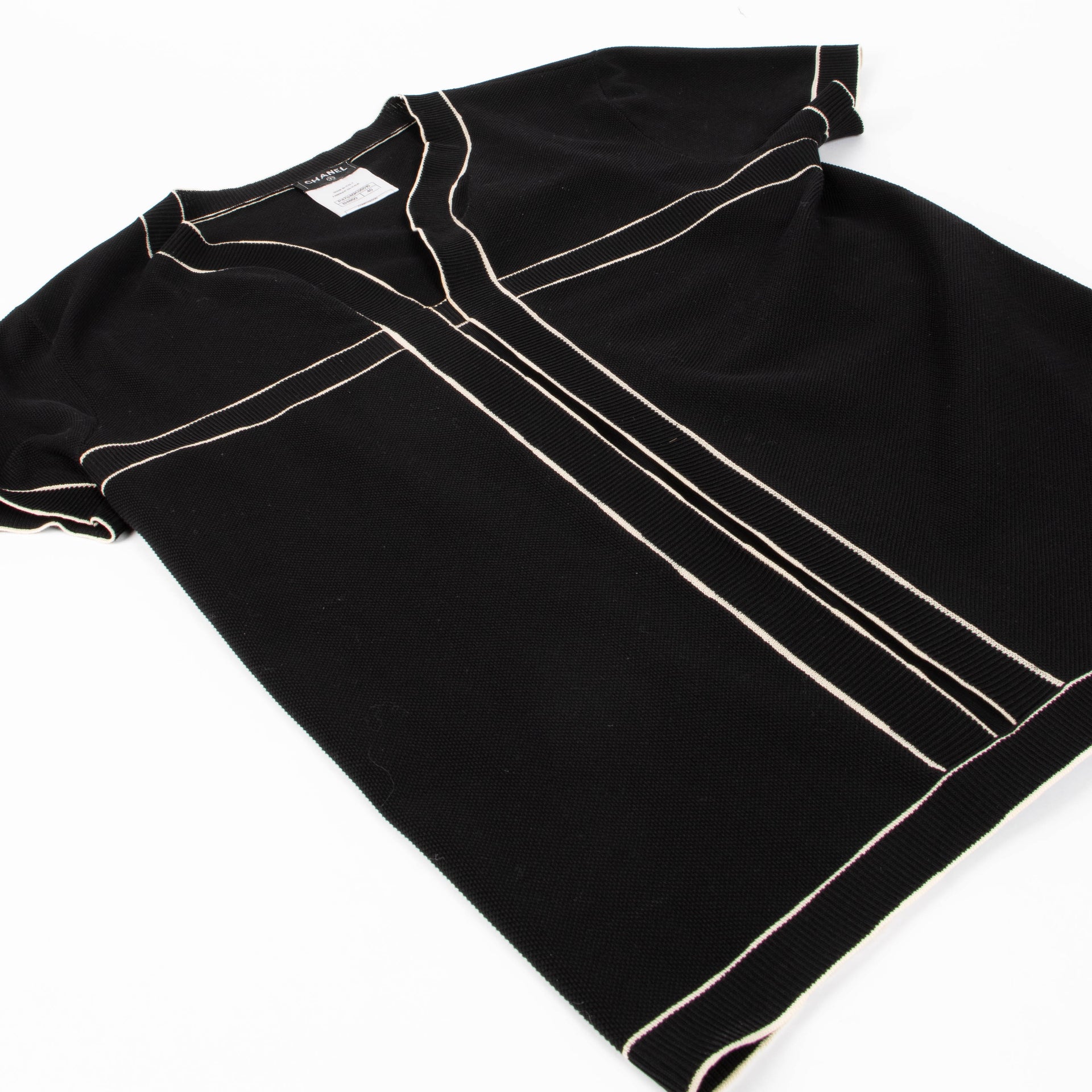 Shop this authentic Chanel Ribbed Knit Coco Mark Short Sleeve Top pre-loved on Labellov.com 