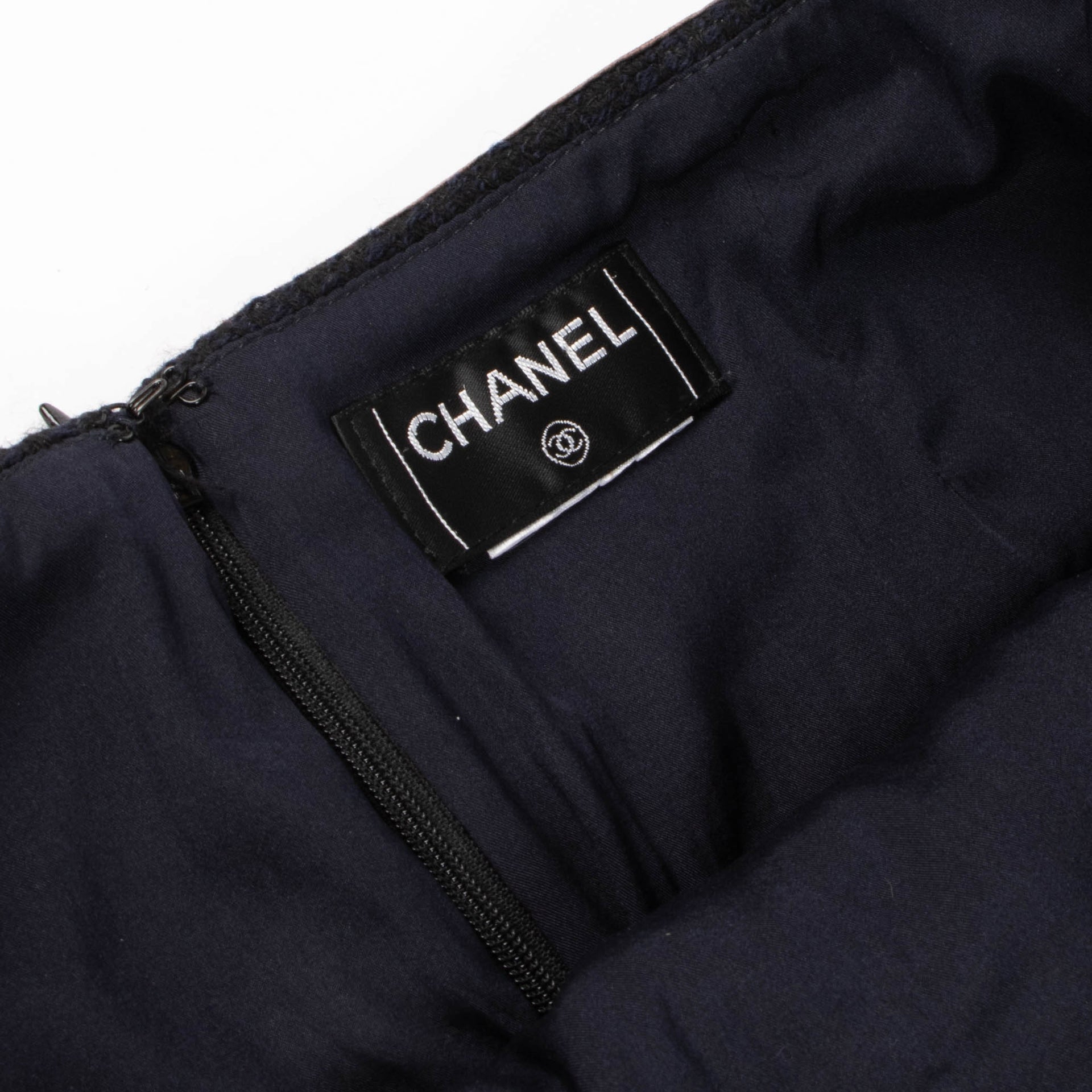 Shop this authentic Chanel Navy Blue Tweed Wool Skirt - Size 40  pre-loved on Labellov.com