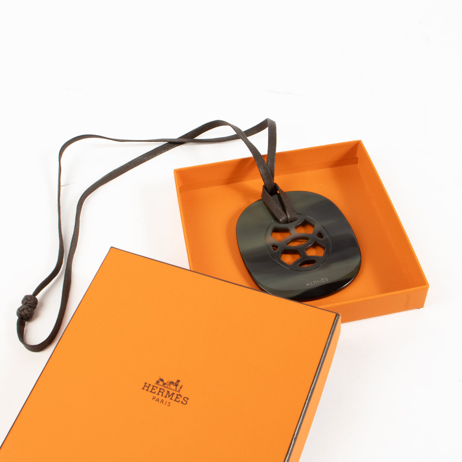 Shop authentic Hermès Buffalo Horn Lift Pendant Necklace on Labellov.com.
