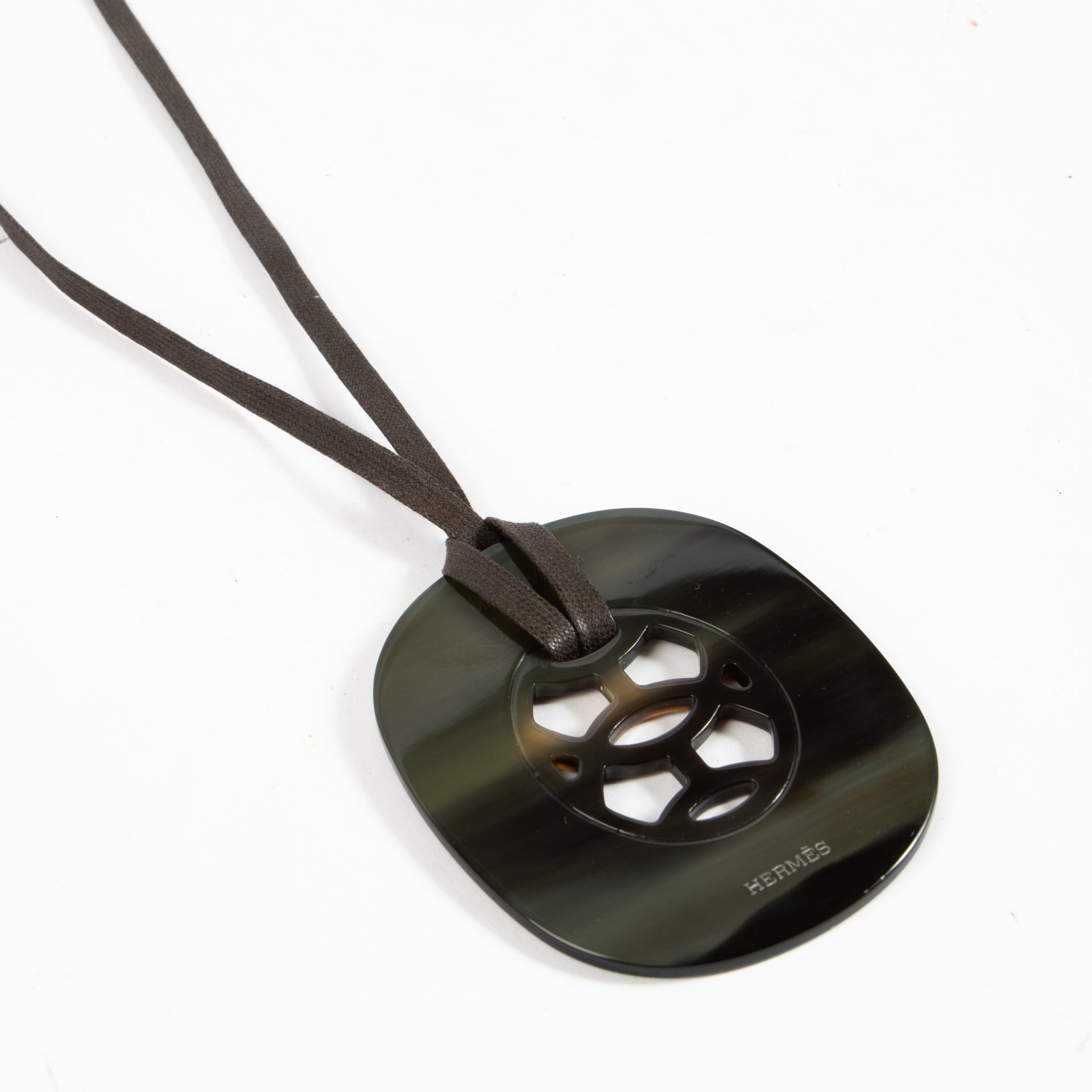 Shop authentic Hermès Buffalo Horn Lift Pendant Necklace on Labellov.com.
