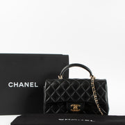 Shop this authentic Chanel Black Lambskin Mini Classic Bag with Handle pre-loved on Labellov.com
