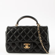 Shop this authentic Chanel Black Lambskin Mini Classic Bag with Handle pre-loved on Labellov.com