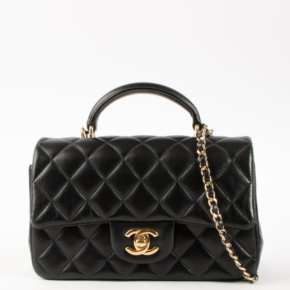 Shop this authentic Chanel Black Lambskin Mini Classic Bag with Handle pre-loved on Labellov.com