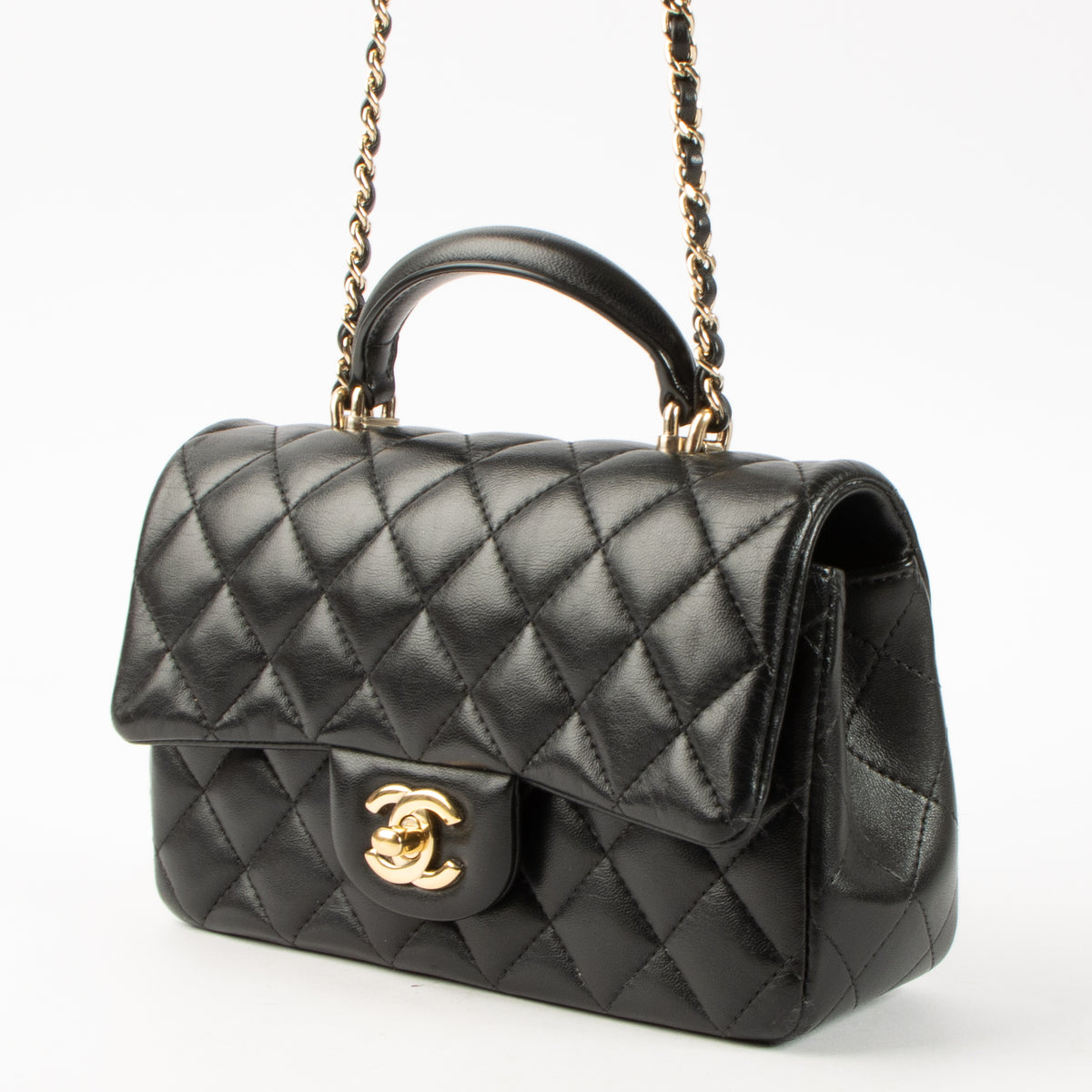 Shop this authentic Chanel Black Lambskin Mini Classic Bag with Handle pre-loved on Labellov.com