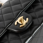 Shop this authentic Chanel Black Lambskin Mini Classic Bag with Handle pre-loved on Labellov.com