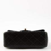 Shop this authentic Chanel Black Lambskin Mini Classic Bag with Handle pre-loved on Labellov.com