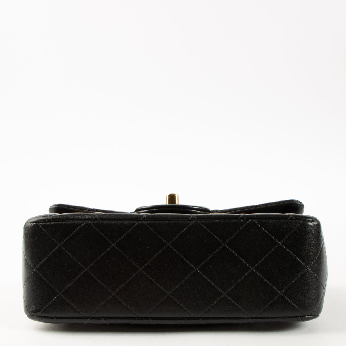 Shop this authentic Chanel Black Lambskin Mini Classic Bag with Handle pre-loved on Labellov.com
