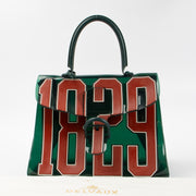 Shop this authentic Delvaux Green Vinyl Brillant The Hero Bag pre-loved on Labellov.com