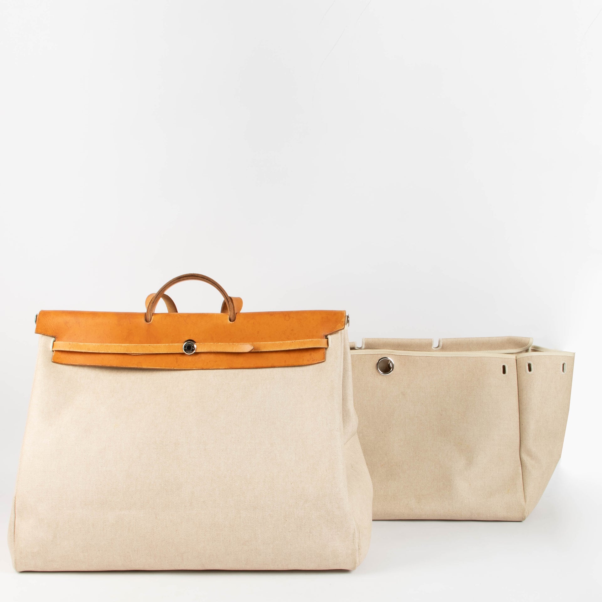 Shop this 100% authentic Hermès Herbag Cabine Canvas/Leather Travel Bag at Labellov.com