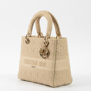 Shop this authentic luxury Christian Dior Beige Canvas Medium Lady D-Lite Bag pre-loved on Labellov.com