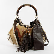 Shop the authentic Gucci Shearling Patchwork Indy Bag second hand on Labellov.com!