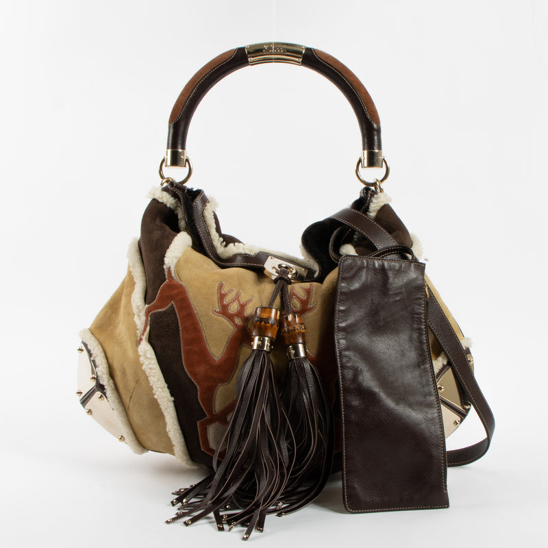 Shop the authentic Gucci Shearling Patchwork Indy Bag second hand on Labellov.com!