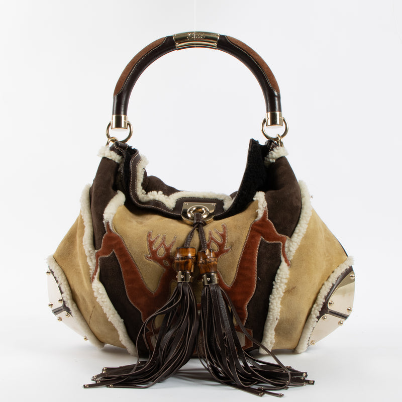 Shop the authentic Gucci Shearling Patchwork Indy Bag second hand on Labellov.com!