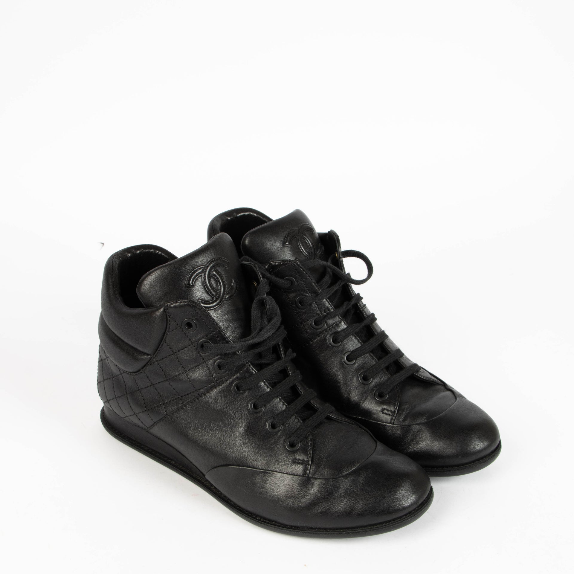 Shop this 100% authentic Chanel Black Sneakers – Size 38.5 at Labellov.com