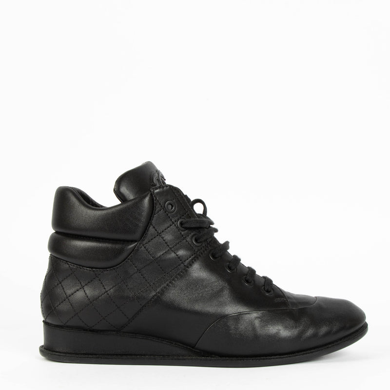 Shop this 100% authentic Chanel Black Sneakers – Size 38.5 at Labellov.com