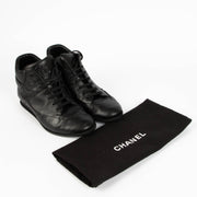 Shop this 100% authentic Chanel Black Sneakers – Size 38.5 at Labellov.com