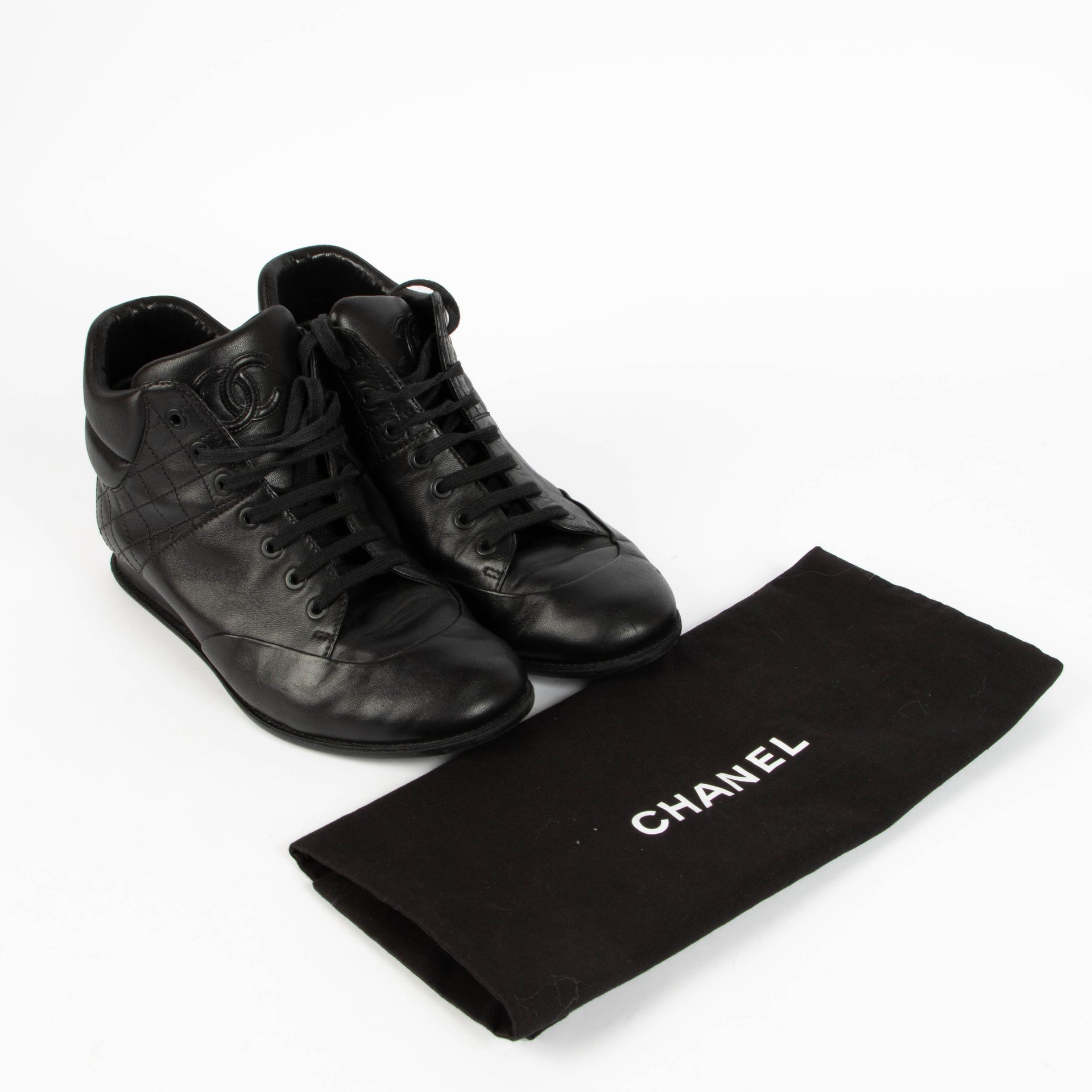 Shop this 100% authentic Chanel Black Sneakers – Size 38.5 at Labellov.com