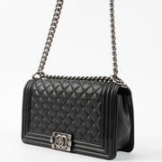 Shop this authentic Chanel Black Medium Boy Chanel Bag pre-loved on Labellov.com