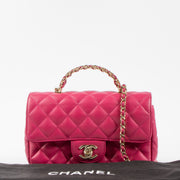 Shop this authentic Chanel Pink Lambskin Mini Classic Bag with Crystal Embellished Handle pre-loved on Labellov.com 