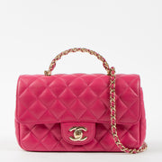 Shop this authentic Chanel Pink Lambskin Mini Classic Bag with Crystal Embellished Handle pre-loved on Labellov.com 