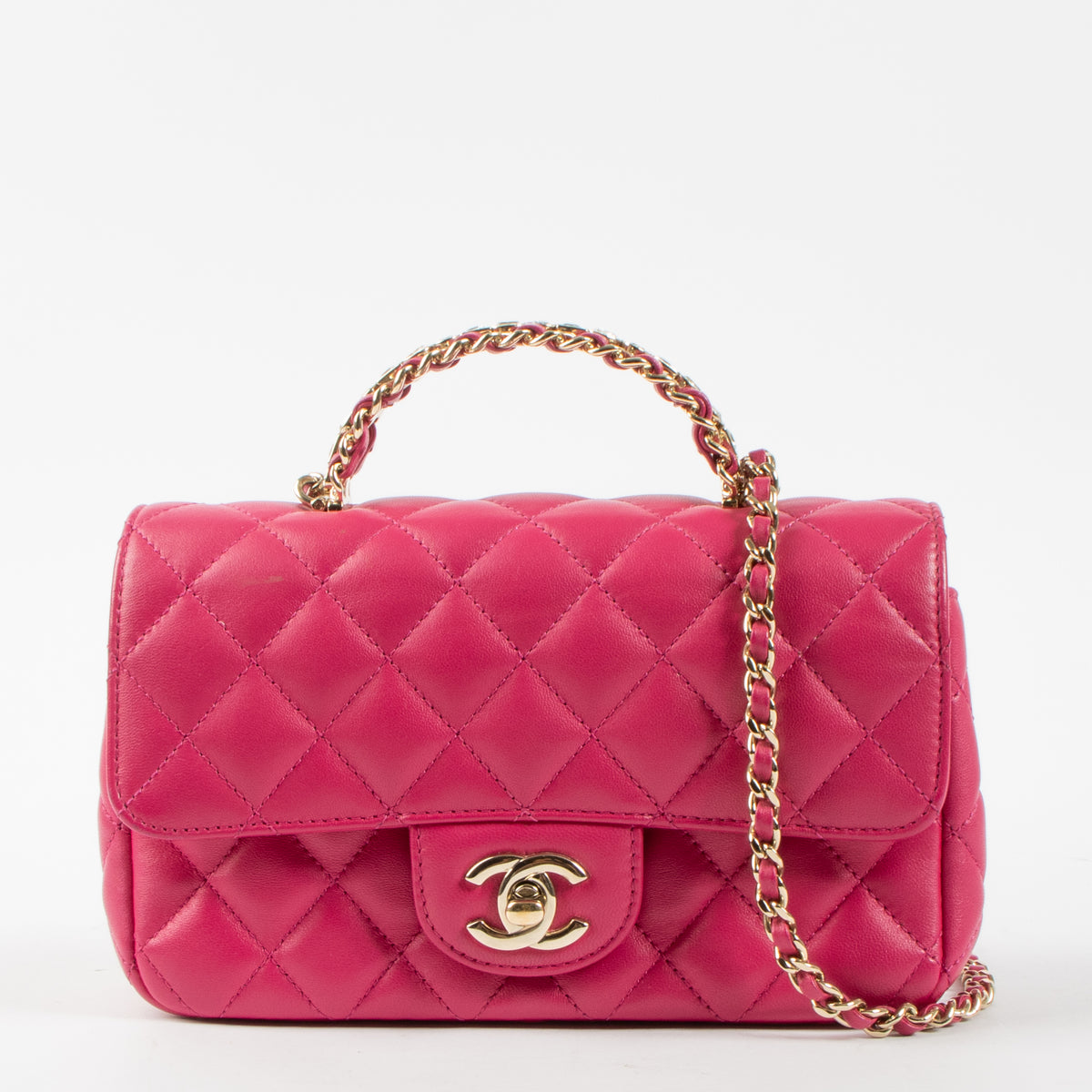Shop this authentic Chanel Pink Lambskin Mini Classic Bag with Crystal Embellished Handle pre-loved on Labellov.com 