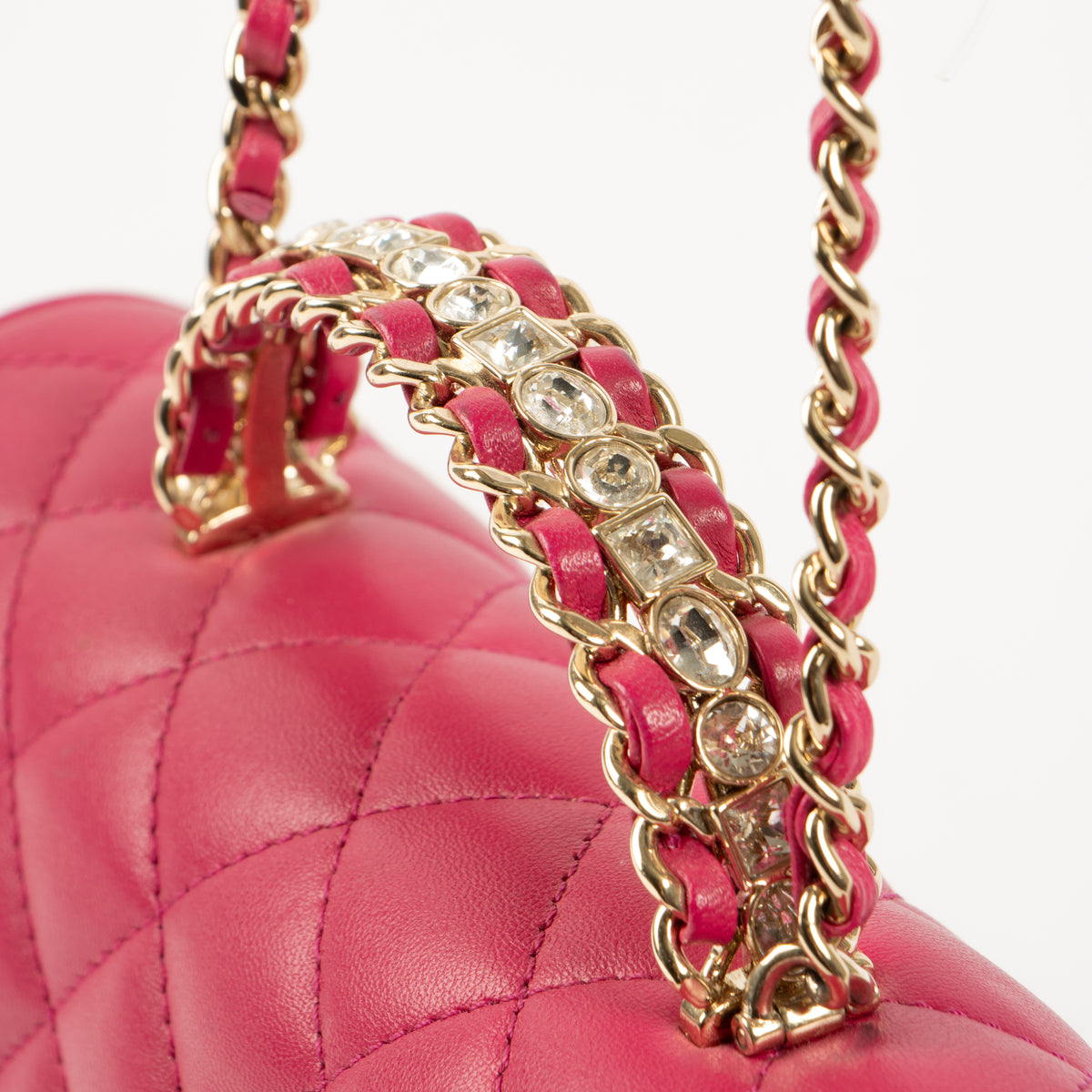 Shop this authentic Chanel Pink Lambskin Mini Classic Bag with Crystal Embellished Handle pre-loved on Labellov.com 