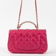 Shop this authentic Chanel Pink Lambskin Mini Classic Bag with Crystal Embellished Handle pre-loved on Labellov.com 