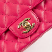 Shop this authentic Chanel Pink Lambskin Mini Classic Bag with Crystal Embellished Handle pre-loved on Labellov.com 