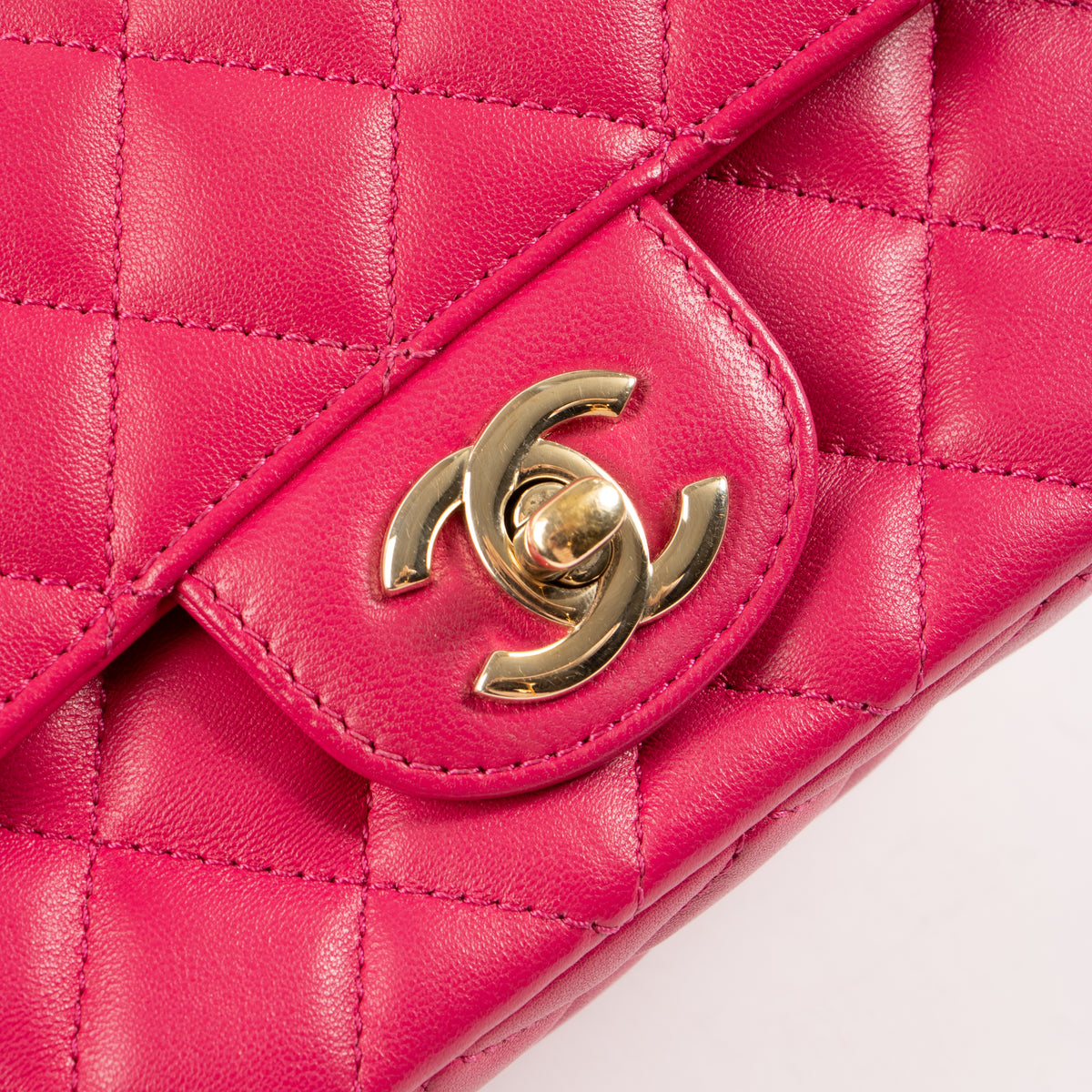 Shop this authentic Chanel Pink Lambskin Mini Classic Bag with Crystal Embellished Handle pre-loved on Labellov.com 