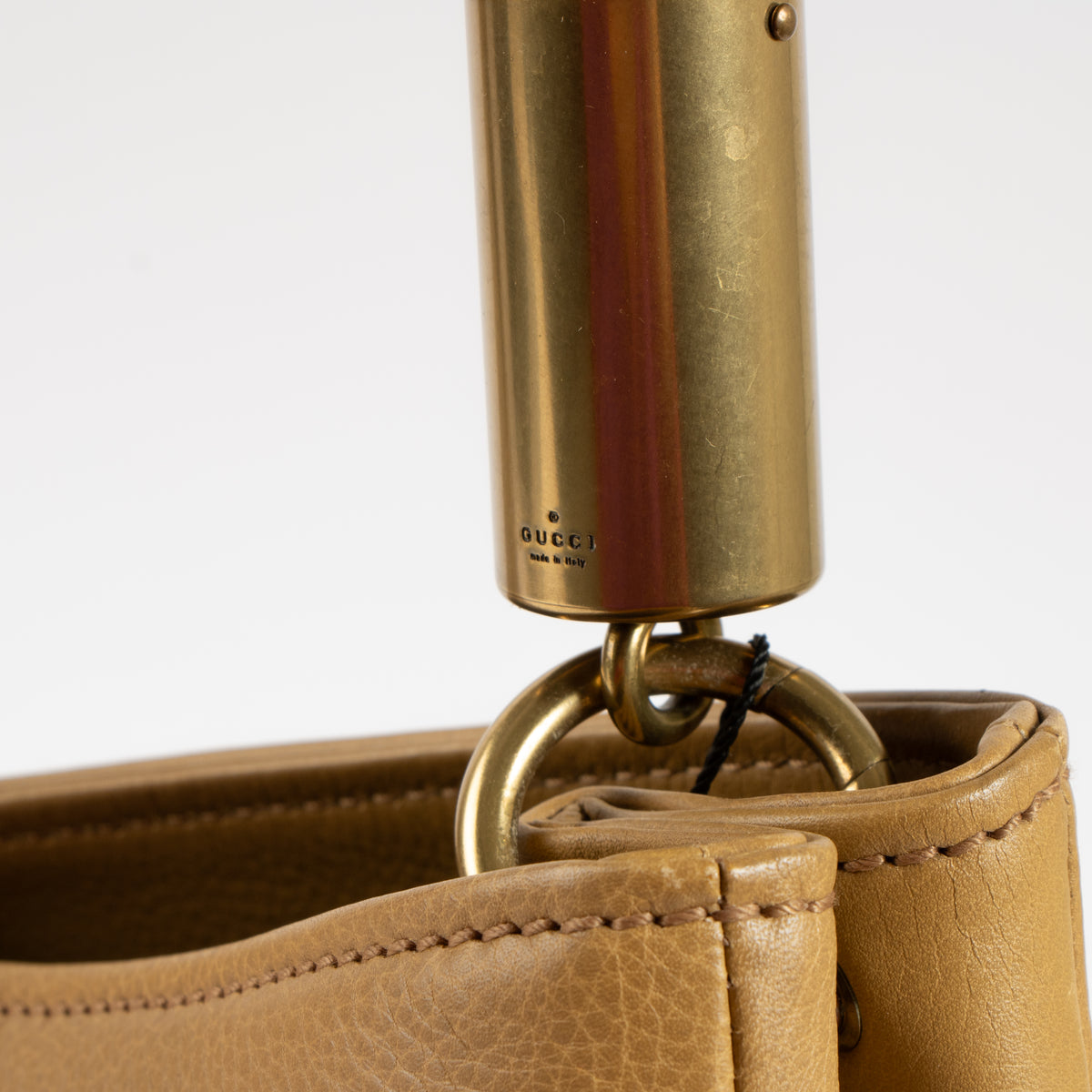 Shop this authentic Gucci Beige Leather Drawstring Bag pre-loved on Labellov.com