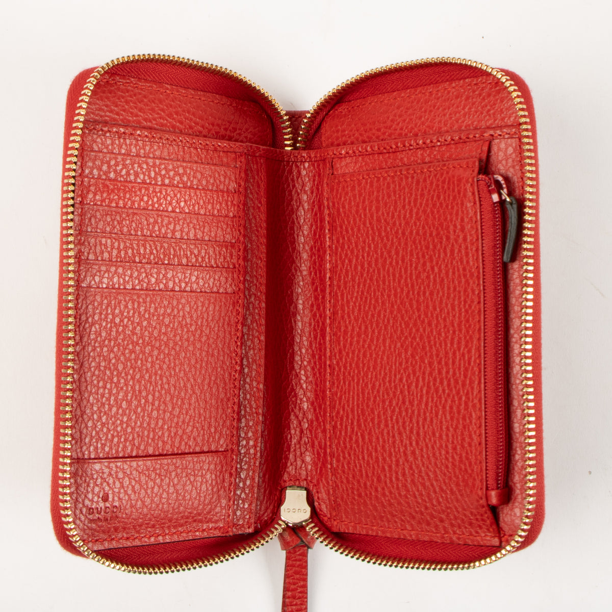 Shop this authentic Gucci Red Leather Swing Zip Wallet pre-loved on Labellov.com