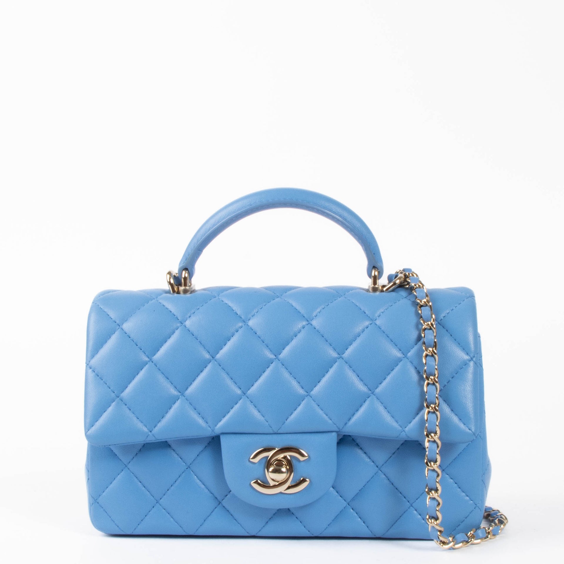 Shop this authentic Chanel Blue Lambskin Mini Flap Bag with Handle pre-loved on Labellov.com