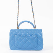Shop this authentic Chanel Blue Lambskin Mini Flap Bag with Handle pre-loved on Labellov.com