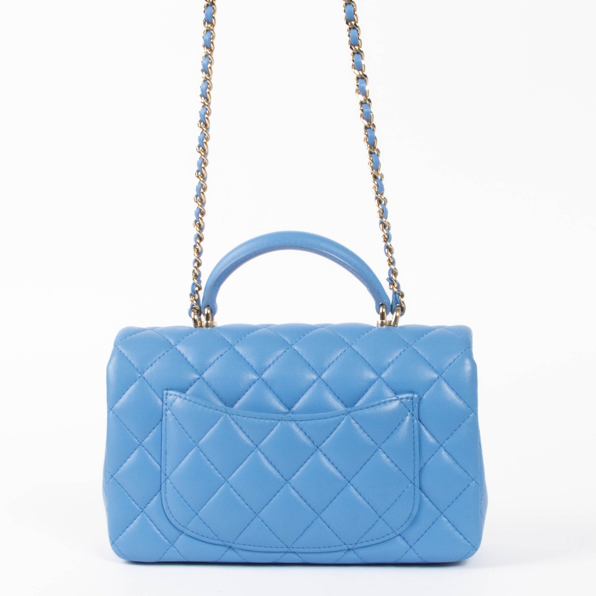 Shop this authentic Chanel Blue Lambskin Mini Flap Bag with Handle pre-loved on Labellov.com