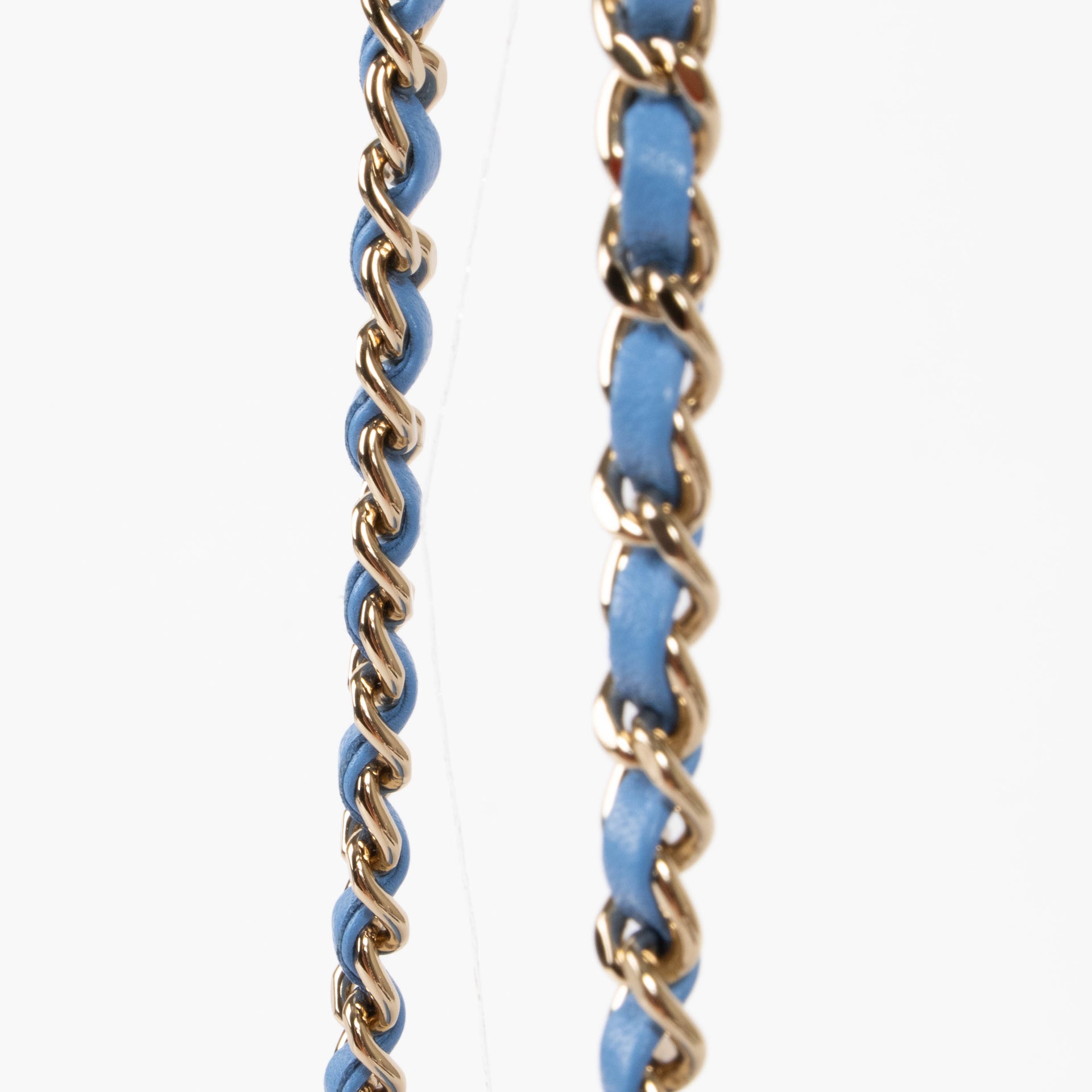 Shop this authentic Chanel Blue Lambskin Mini Flap Bag with Handle pre-loved on Labellov.com