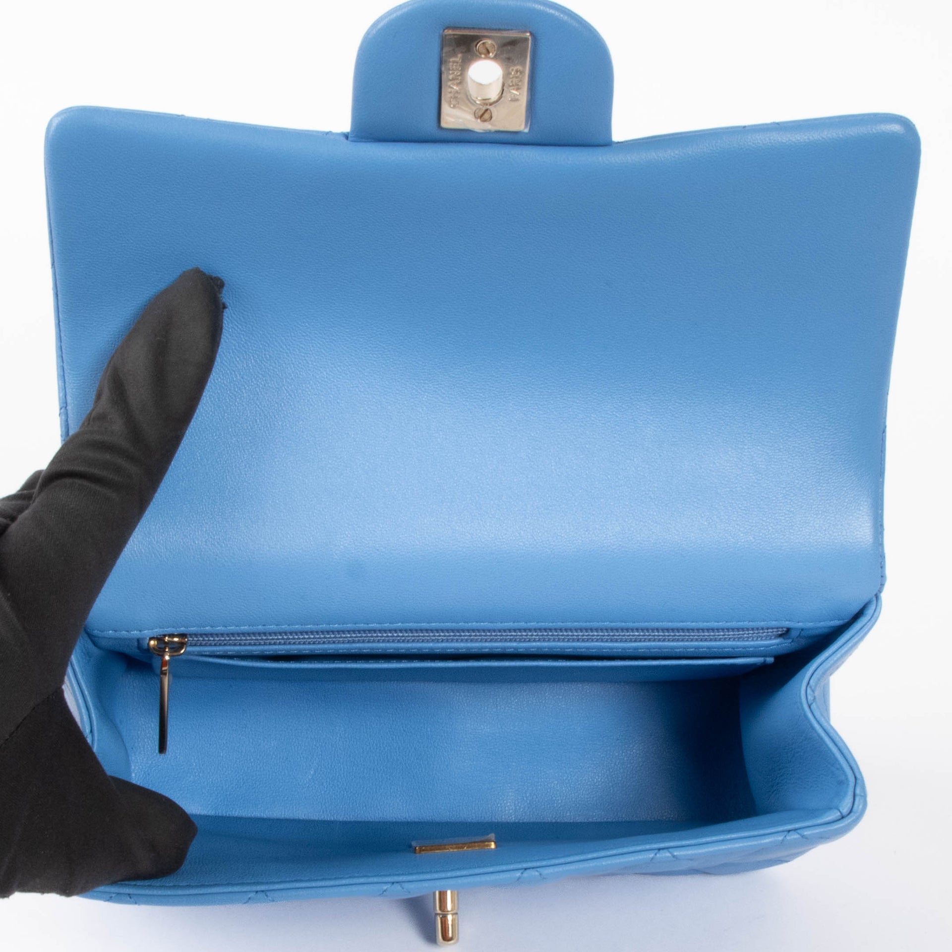 Shop this authentic Chanel Blue Lambskin Mini Flap Bag with Handle pre-loved on Labellov.com
