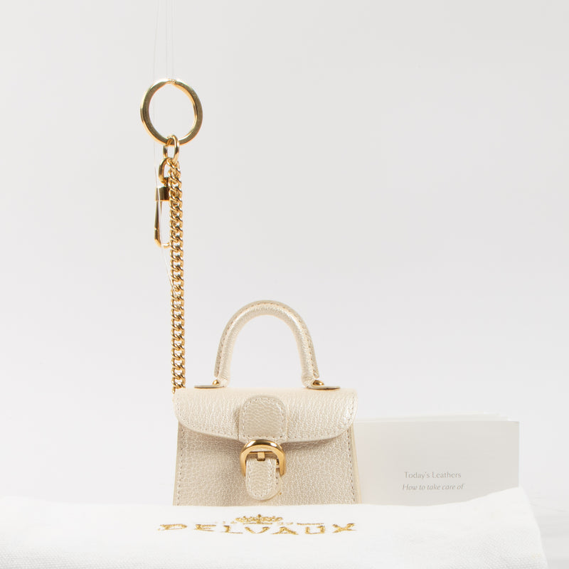 Shop the authentic Delvaux Light Gold Chevre Brillant Charms second hand on Labellov.com!