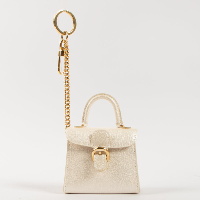 Shop the authentic Delvaux Light Gold Chevre Brillant Charms second hand on Labellov.com!