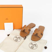 Shop the authentic Hermes Oran Brown Embroidered Sandals - Size 37 brand-new on Labellov.com