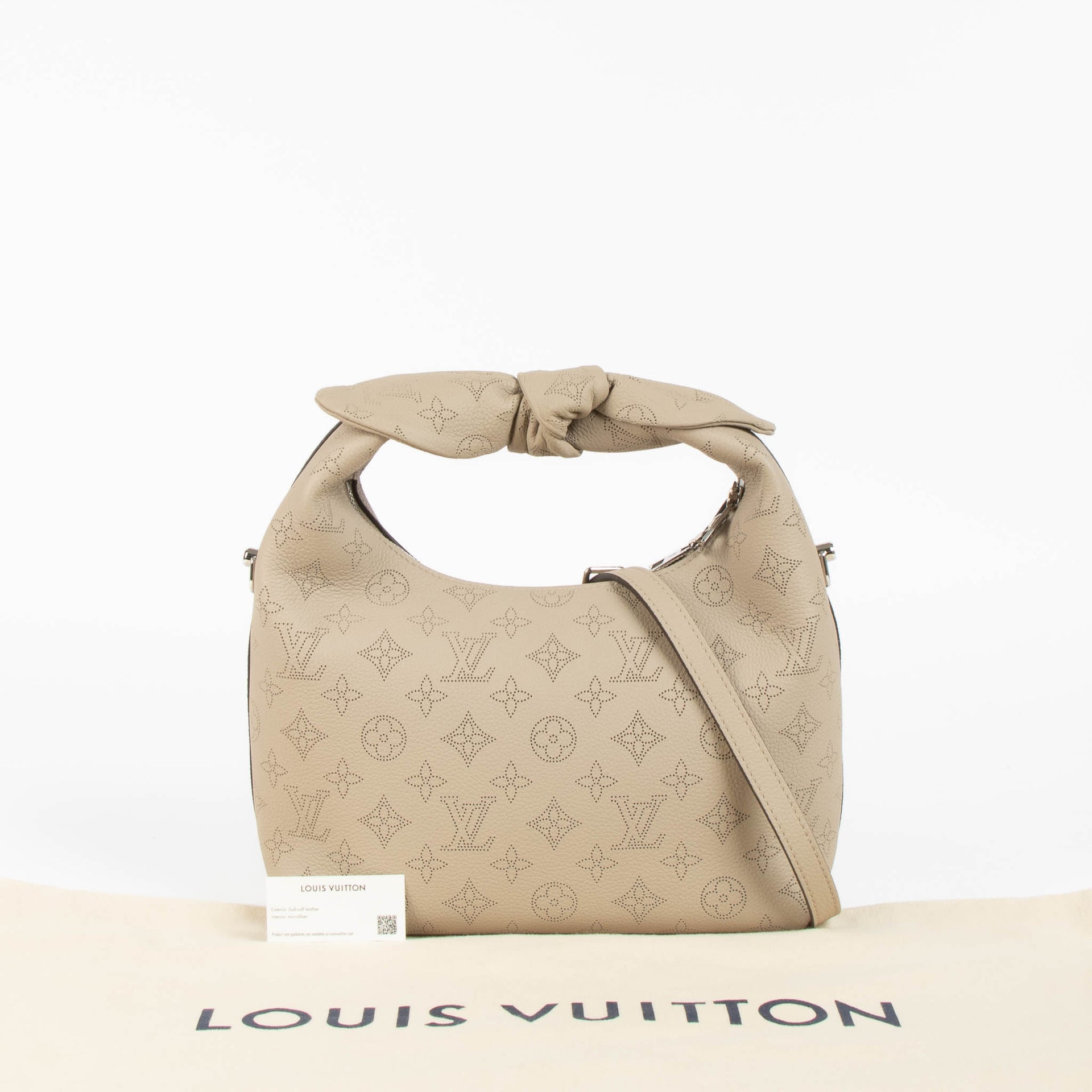 Shop this 100% authentic Louis Vuitton Tourterelle Why Knot Bag at Labellov.com